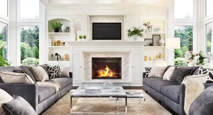 A modern, naturally lit, and luxurious living room interior boasting a fireplace that helps heat the house.