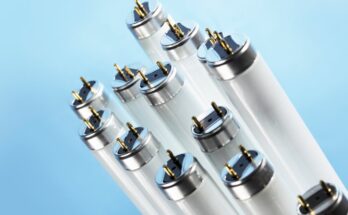 A close-up view shows thirteen fluorescent tube lights against a light blue background that gradually gets darker.