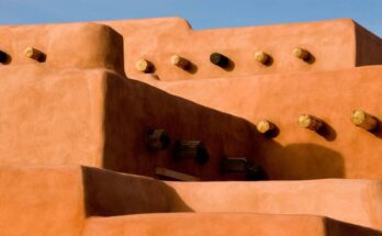 Close-up on the subtle details of the type of lovely orange adobe home found most often in New Mexico.